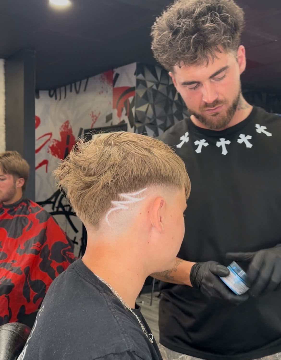 Austin Causey at work in the barbershop